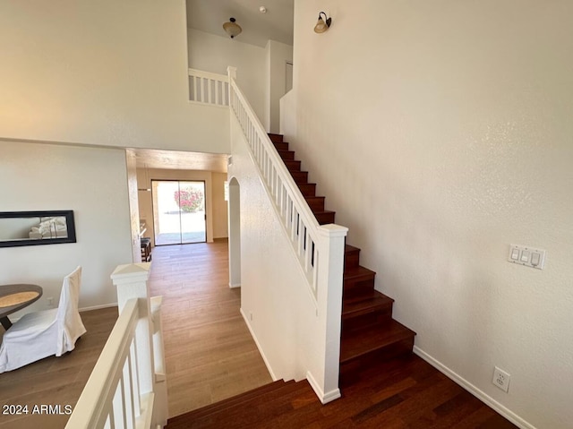 stairs with wood-type flooring