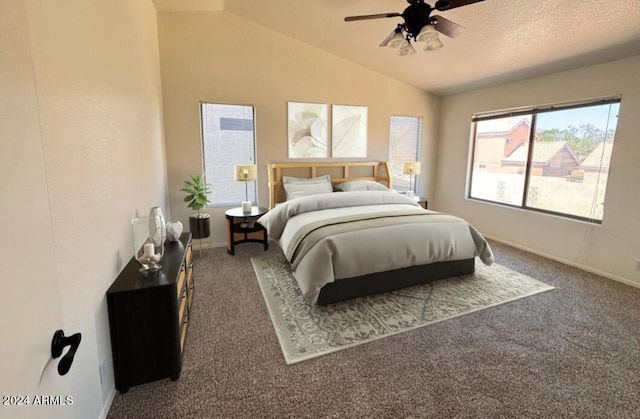 bedroom featuring ceiling fan, a textured ceiling, dark colored carpet, and vaulted ceiling