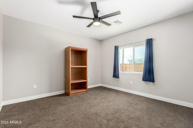 683 W Raymond St, Coolidge, AZ 85128 - unfurnished room with ceiling fan, dark colored carpet, and baseboards