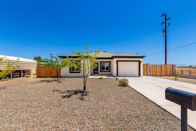 683 W Raymond St, Coolidge, AZ 85128 - view of front of home featuring concrete driveway, a garage, and stucco siding