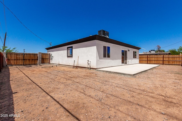 683 W Raymond St, Coolidge, AZ 85128 - rear view of property featuring a patio area, central air condition unit, stucco siding, and a fenced backyard