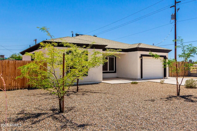683 W Raymond St, Coolidge, AZ 85128 - view of front facade with an attached garage, concrete driveway, and stucco siding