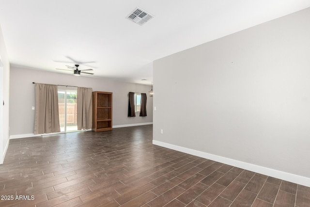 683 W Raymond St, Coolidge, AZ 85128 - spare room featuring wood finish floors, a ceiling fan, and baseboards