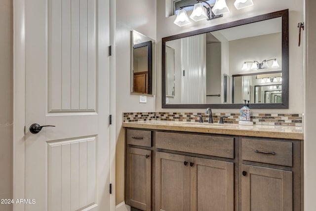 bathroom with backsplash and vanity