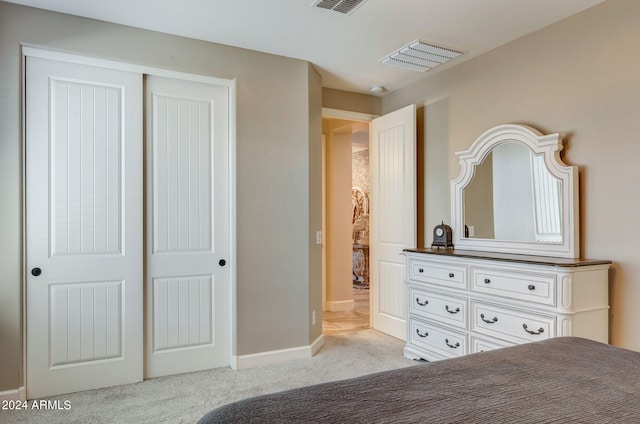 carpeted bedroom with a closet