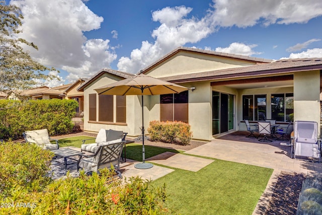 rear view of house featuring a patio area