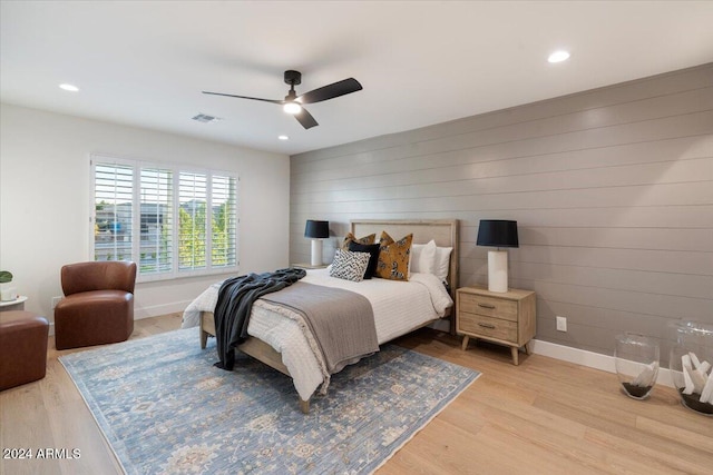 bedroom with recessed lighting and light wood-style floors