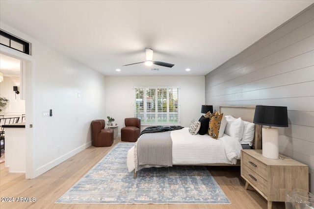 bedroom with ceiling fan, recessed lighting, light wood finished floors, and baseboards
