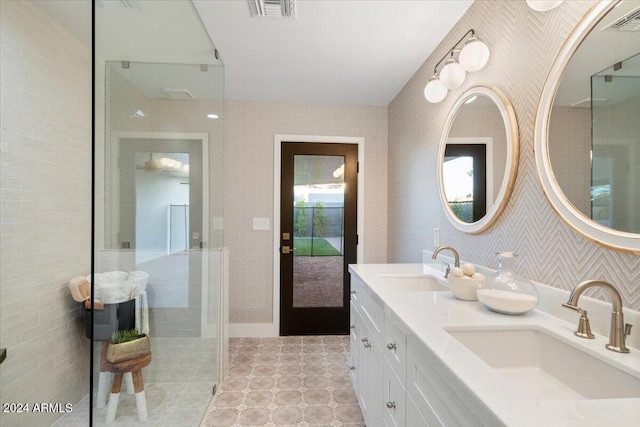 bathroom with vanity and a shower