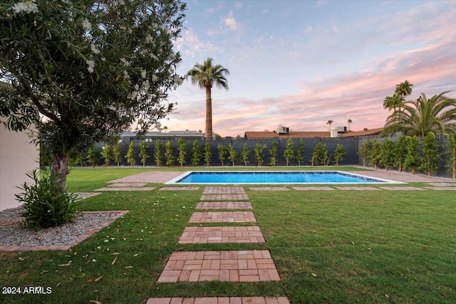 view of pool featuring a fenced backyard, a fenced in pool, and a lawn