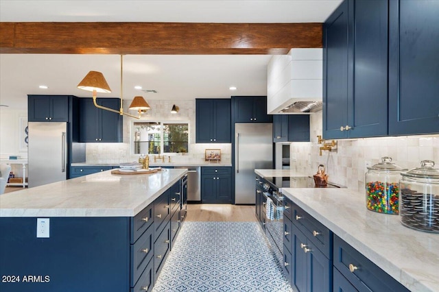 kitchen featuring beam ceiling, blue cabinets, light hardwood / wood-style flooring, custom range hood, and stainless steel appliances