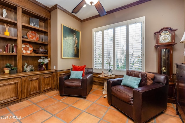 living area featuring light tile patterned floors, a wealth of natural light, crown molding, and ceiling fan