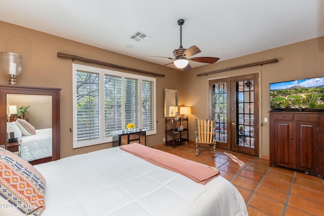 tiled bedroom with access to outside, ceiling fan, and french doors