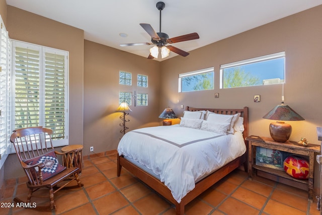 bedroom featuring ceiling fan and tile patterned flooring