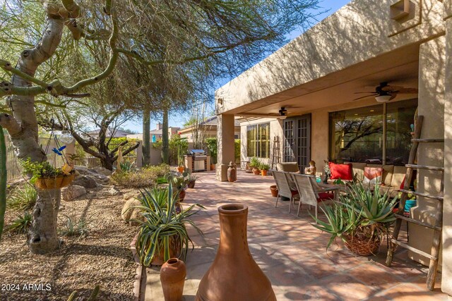 view of patio / terrace featuring ceiling fan