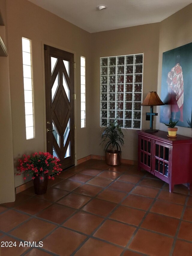 entryway featuring dark tile patterned flooring