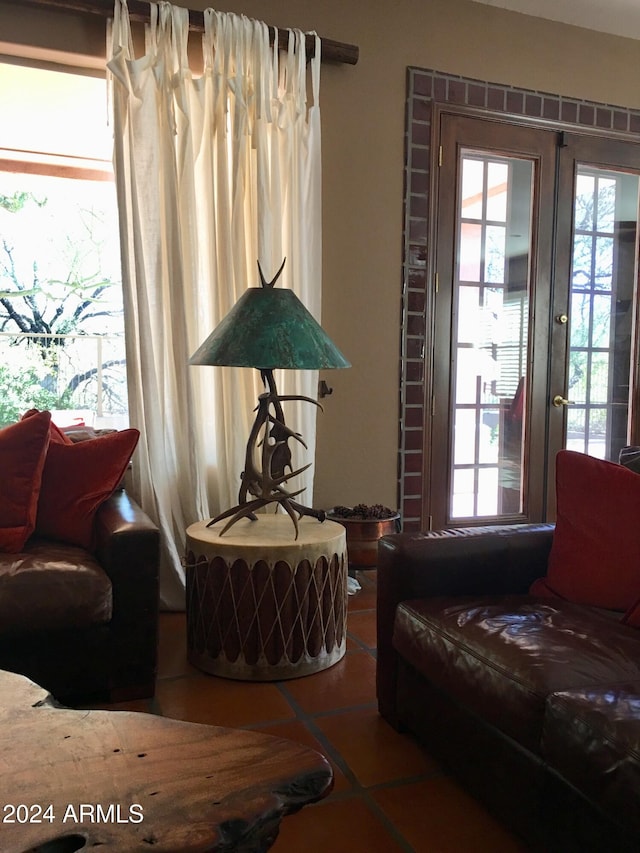 living room with tile patterned flooring and french doors