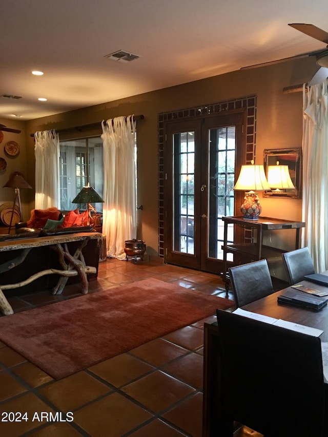 bedroom with access to exterior, french doors, and tile patterned floors