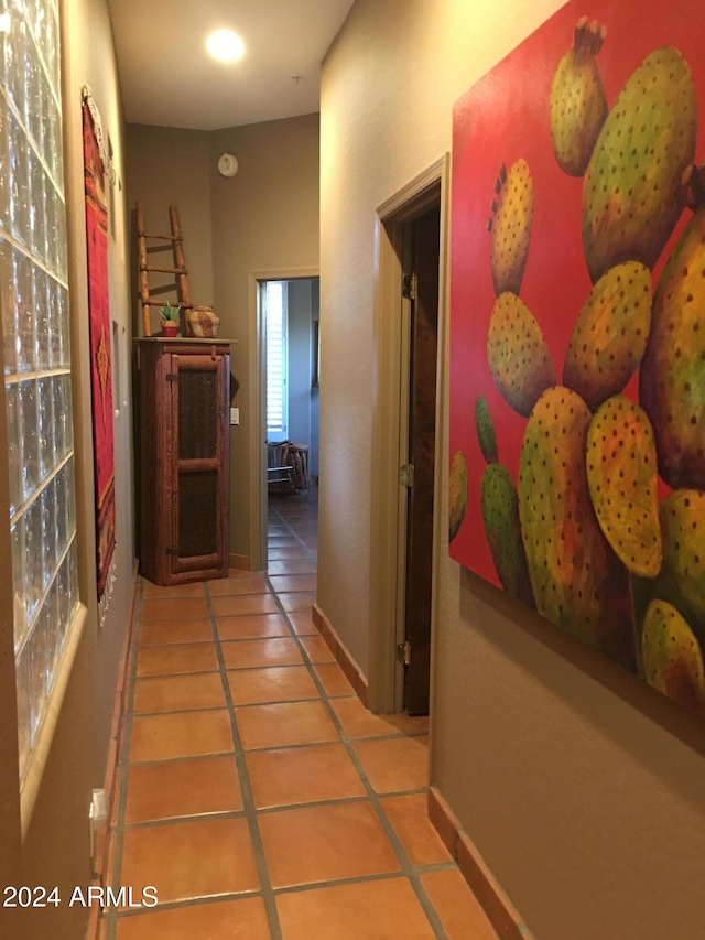 hall featuring tile patterned flooring