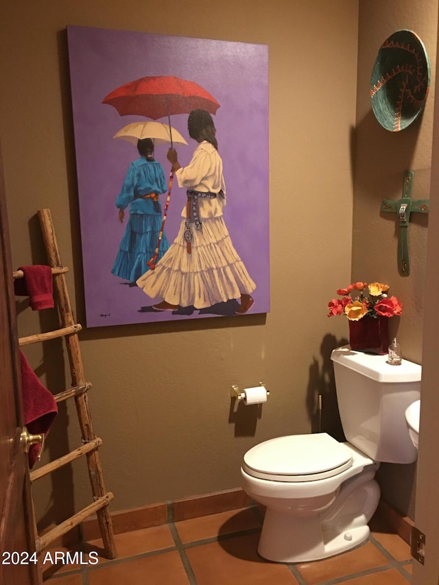 bathroom with tile patterned floors and toilet