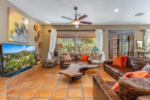 living room with ceiling fan and light tile patterned floors