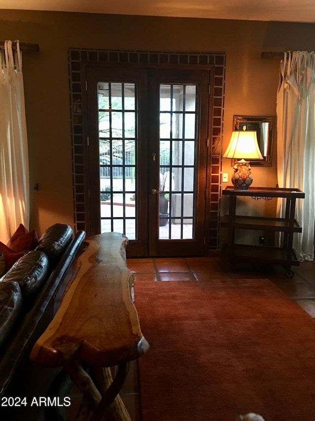 doorway with tile patterned flooring