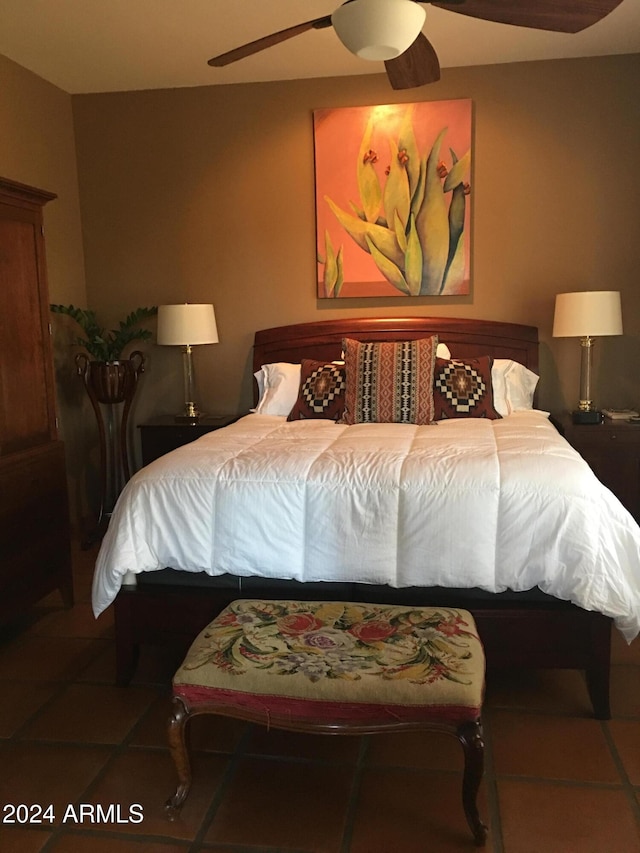 bedroom with tile patterned flooring and ceiling fan