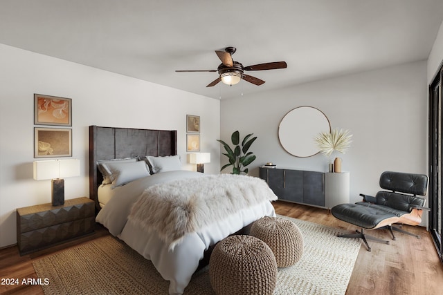 bedroom featuring hardwood / wood-style floors and ceiling fan