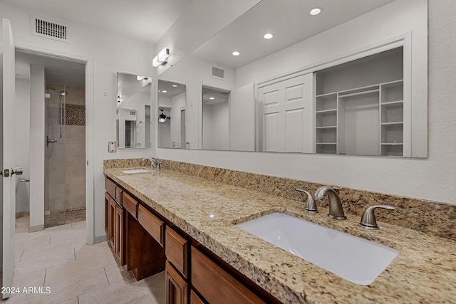 bathroom with vanity, tile patterned floors, and walk in shower