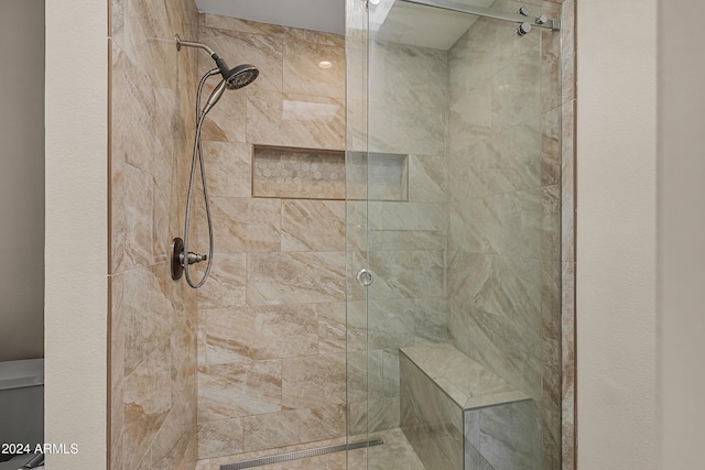 bathroom featuring an enclosed shower