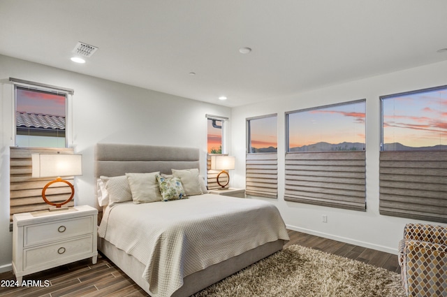 bedroom featuring dark hardwood / wood-style flooring