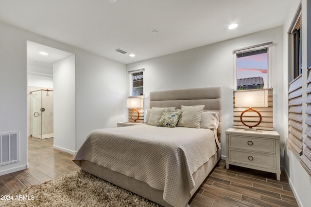 bedroom with dark hardwood / wood-style floors