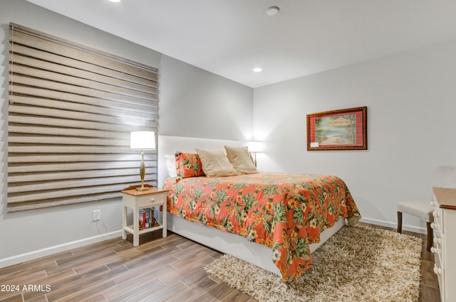 bedroom with hardwood / wood-style flooring