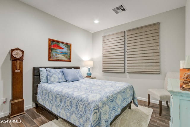 bedroom featuring dark hardwood / wood-style floors