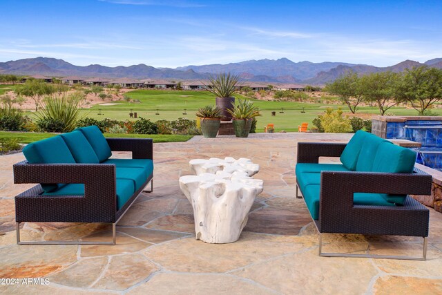 view of patio featuring an outdoor hangout area and a mountain view