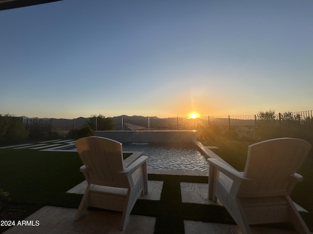 view of patio terrace at dusk