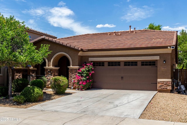 15588 W Devonshire Ave, Goodyear, AZ 85395 - view of front of house featuring stone siding, a tiled roof, and stucco siding