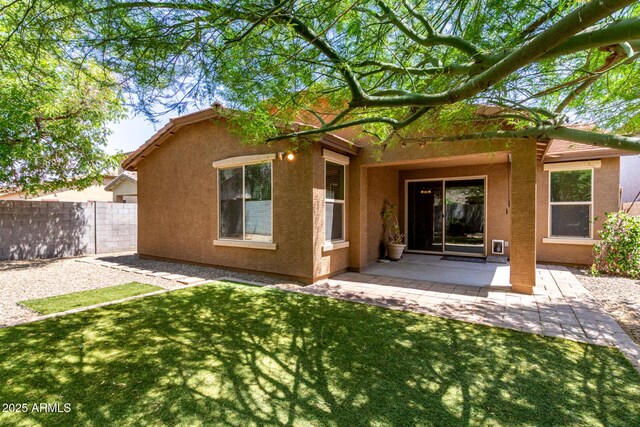 15588 W Devonshire Ave, Goodyear, AZ 85395 - rear view of property with stucco siding and a patio