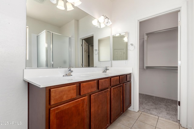 15588 W Devonshire Ave, Goodyear, AZ 85395 - bathroom with tile patterned flooring, a shower stall, double vanity, and a chandelier