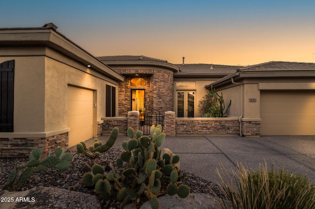 prairie-style home featuring a garage