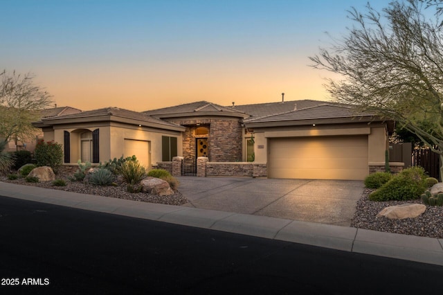 prairie-style home featuring a garage