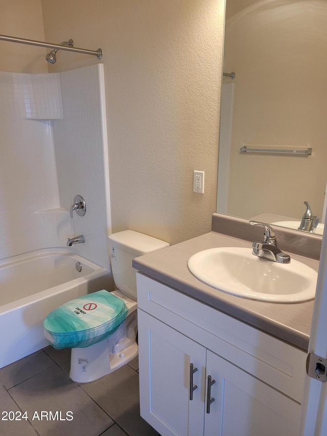 full bathroom with shower / washtub combination, vanity, toilet, and tile patterned floors