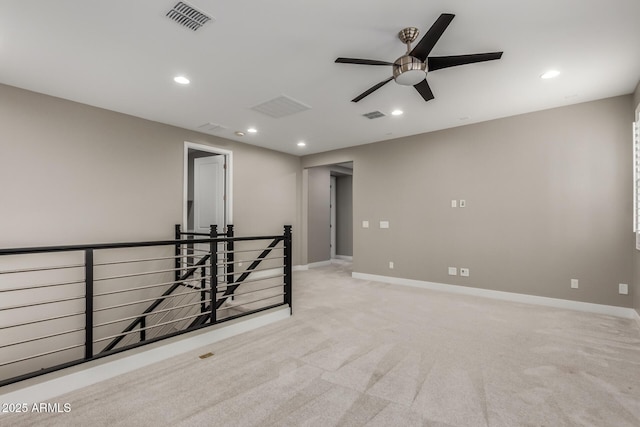 spare room featuring visible vents, recessed lighting, baseboards, and ceiling fan