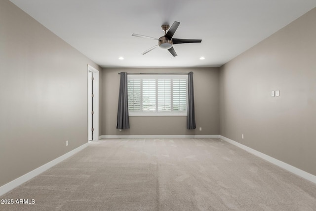 unfurnished room featuring recessed lighting, light colored carpet, baseboards, and a ceiling fan