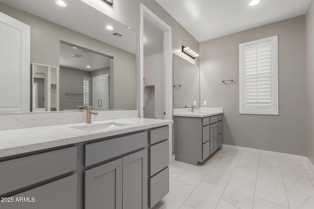 bathroom featuring visible vents, recessed lighting, a stall shower, a sink, and marble finish floor