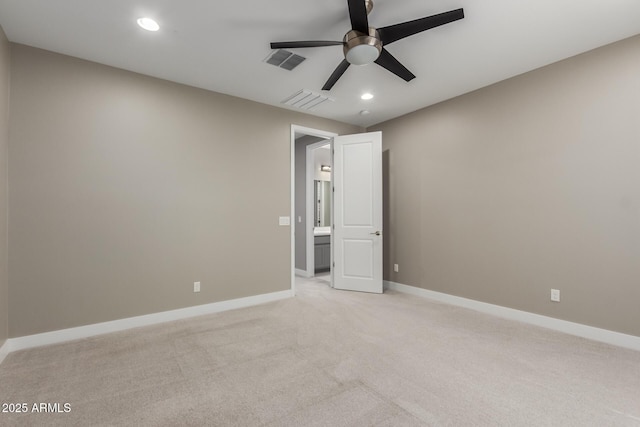 spare room with visible vents, light carpet, recessed lighting, baseboards, and ceiling fan