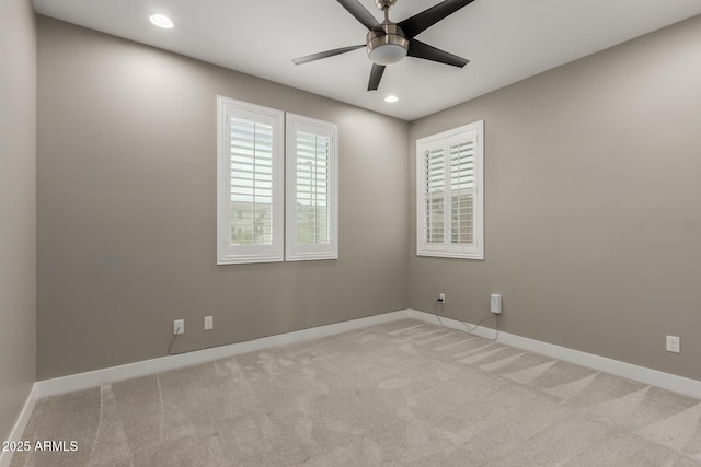 unfurnished room with recessed lighting, a ceiling fan, baseboards, and light carpet