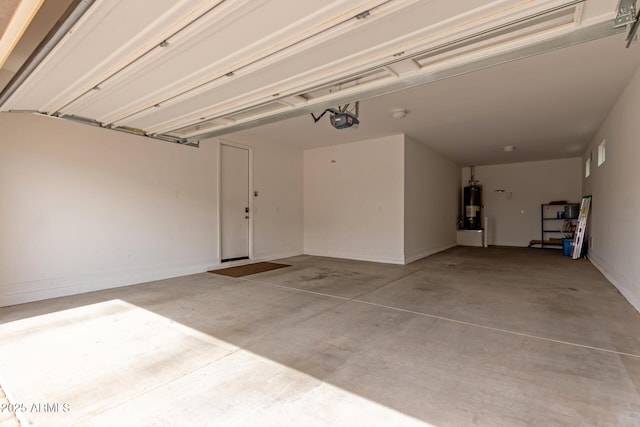 garage with a garage door opener and water heater