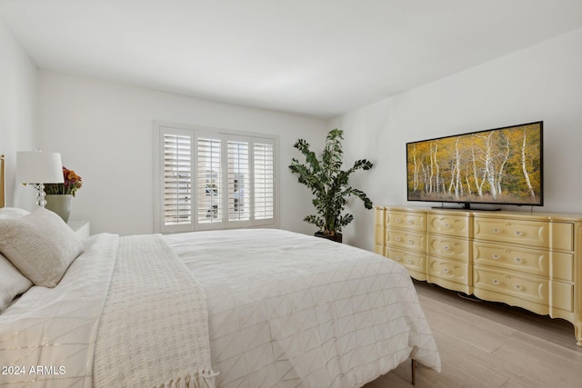 bedroom with light hardwood / wood-style flooring