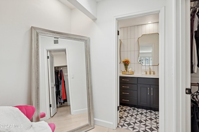 bathroom featuring hardwood / wood-style flooring and vanity